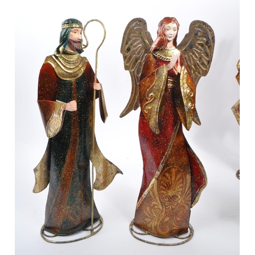 317 - A collection of religious figures ornaments Christmas decorations. To include some members of the Na... 