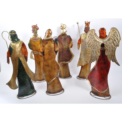 317 - A collection of religious figures ornaments Christmas decorations. To include some members of the Na... 