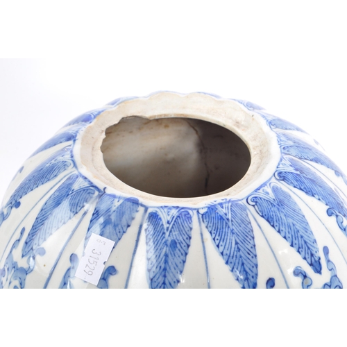 133 - A large blue and white contemporary Chinese pumpkin shaped vase with floral decoration. Measures 21 ... 