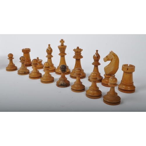 302 - A 20th Century turned and hand carved wood chess set. The set being incomplete and with restoration.... 