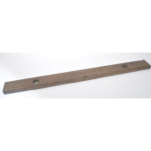 303 - A vintage mid 20th century oak spirit level. Long rectangular form with bubble to centre. Measures a... 