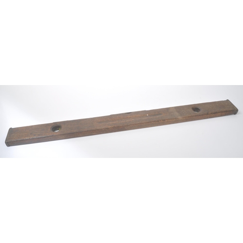 303 - A vintage mid 20th century oak spirit level. Long rectangular form with bubble to centre. Measures a... 