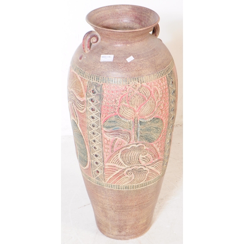 181 - A large contemporary Anglo-Indian floor standing vase. The vase having flared rim over a body decora... 