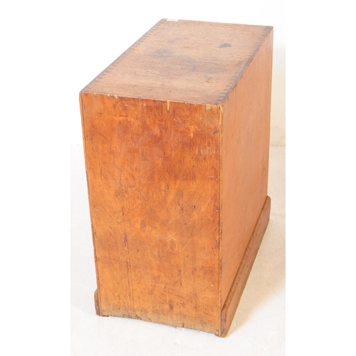 1015 - An early 20th century oak campaign pedestal chest of drawers. Rectangular form with a bank of three ... 