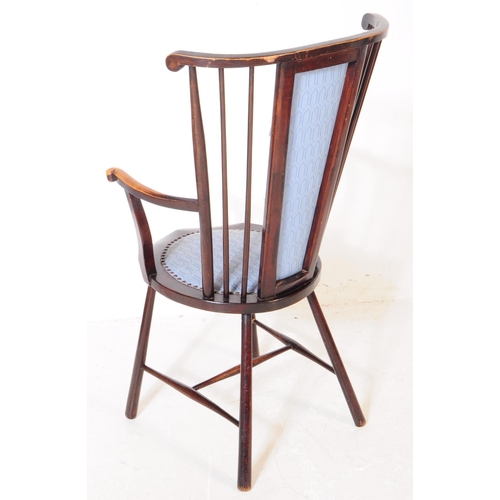 1021 - Two early 20th century Arts and Crafts beech wood ebonised armchairs. The chairs each having blue fa... 