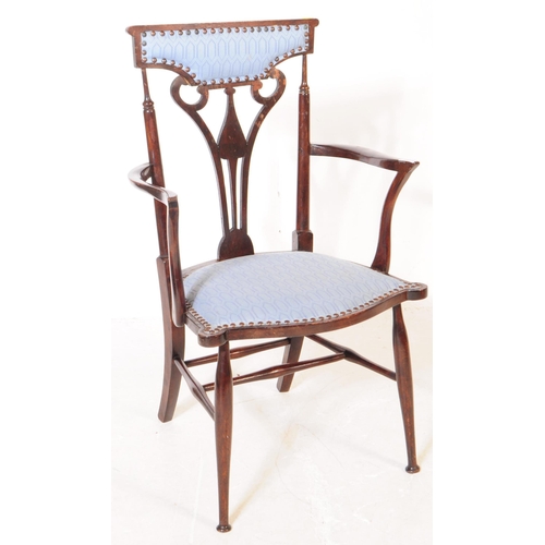 1021 - Two early 20th century Arts and Crafts beech wood ebonised armchairs. The chairs each having blue fa... 