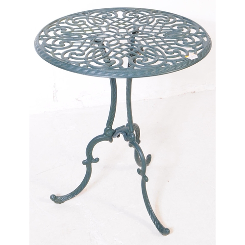 1024 - A Victorian style reproduction garden / courtyard table with a pair of chairs. With pierced oval bac... 