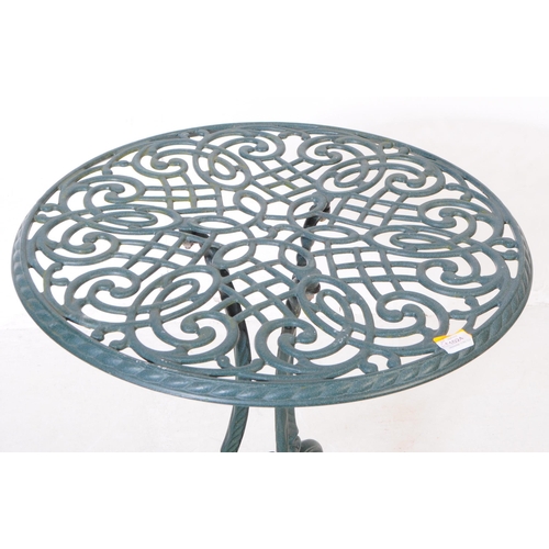 1024 - A Victorian style reproduction garden / courtyard table with a pair of chairs. With pierced oval bac... 