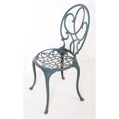 1024 - A Victorian style reproduction garden / courtyard table with a pair of chairs. With pierced oval bac... 