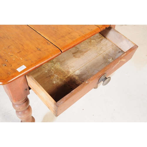 1026 - A Victorian 19th century scrub pine kitchen / dining table. Rectangular form with flared top, single... 