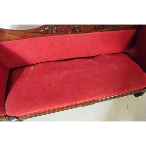 1027 - A Victorian 19th century mahogany three seater sofa / settee. With arched curved backrest with carve... 