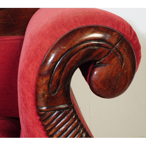 1027 - A Victorian 19th century mahogany three seater sofa / settee. With arched curved backrest with carve... 