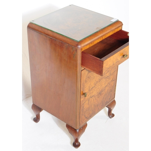 1035 - An early 20th century 1930s Art Deco burr walnut bedside table / cupboard. The bedside raised on cab... 