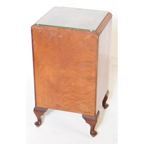 1035 - An early 20th century 1930s Art Deco burr walnut bedside table / cupboard. The bedside raised on cab... 