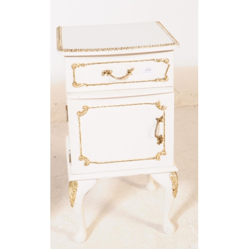 1037 - A pair of 20th century French Louis XVI manner bedside tables / cabinets. Each raised on cabriole le... 