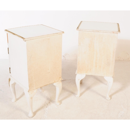 1037 - A pair of 20th century French Louis XVI manner bedside tables / cabinets. Each raised on cabriole le... 