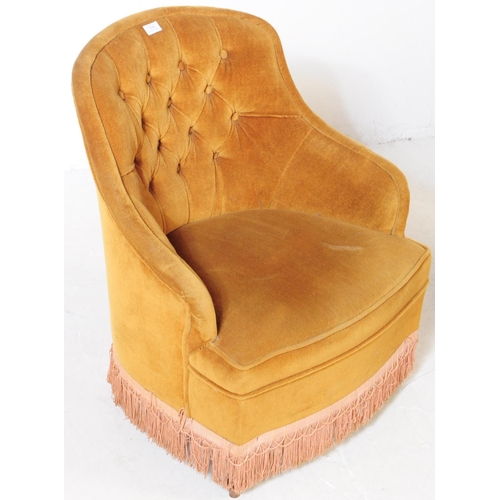 566a - An early 20th century French manner boudoir button back lounge chair / armchair. The chair upholster... 