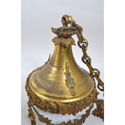 1041 - A 19th Century French ormolu pendant light with frosted cut glass shade. The light of circular form ... 