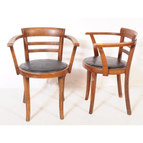 1047 - A set of three mid 20th century bistro Thonet manner bentwood armchairs. Having wrap around tub chai... 