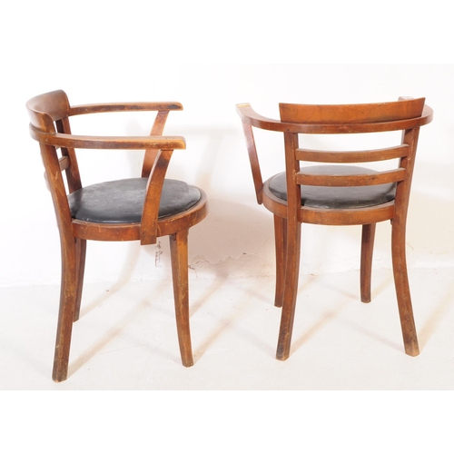 1047 - A set of three mid 20th century bistro Thonet manner bentwood armchairs. Having wrap around tub chai... 