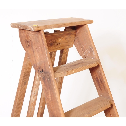 567a - A vintage 20th century wooden pine step ladder. Having an A frame with folding mechanism. Measures a... 