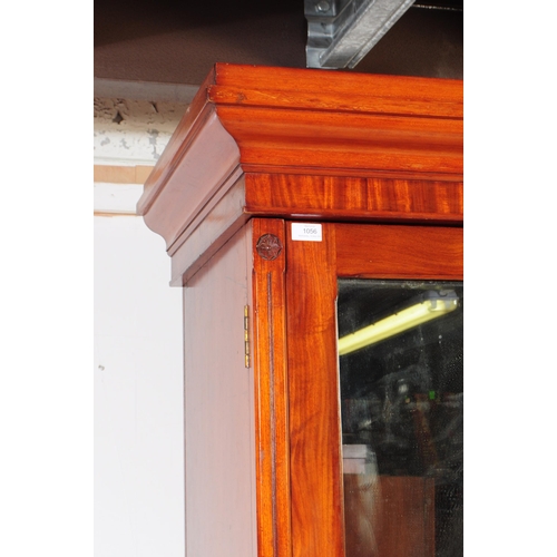 1056 - A 19th century Arts & Crafts mahogany compactum wardrobe. The wardrobe raised on a plinth base below... 