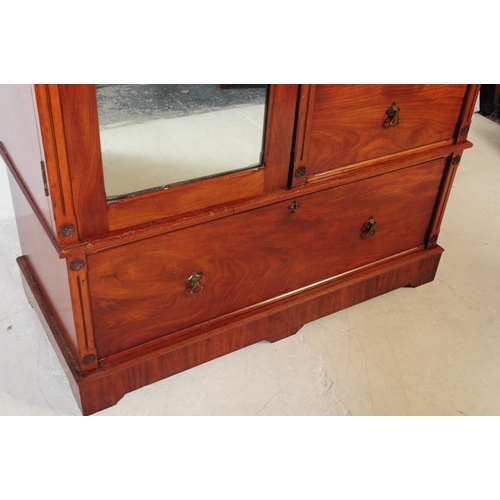 1056 - A 19th century Arts & Crafts mahogany compactum wardrobe. The wardrobe raised on a plinth base below... 