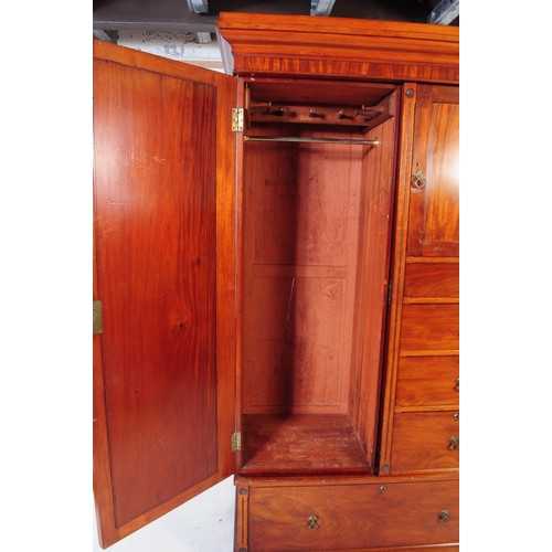 1056 - A 19th century Arts & Crafts mahogany compactum wardrobe. The wardrobe raised on a plinth base below... 