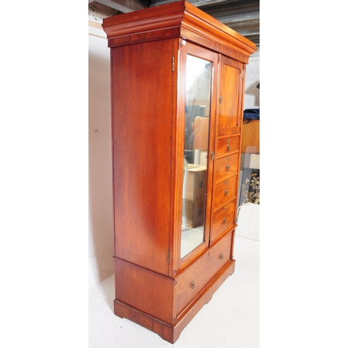 1056 - A 19th century Arts & Crafts mahogany compactum wardrobe. The wardrobe raised on a plinth base below... 