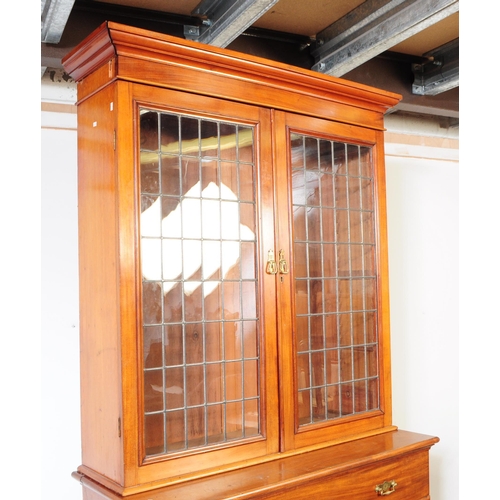 1057 - A large early 20th century mahogany library bookcase cabinet. With pediment top, twin lead glazed hi... 