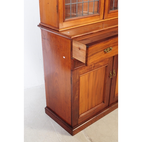 1057 - A large early 20th century mahogany library bookcase cabinet. With pediment top, twin lead glazed hi... 