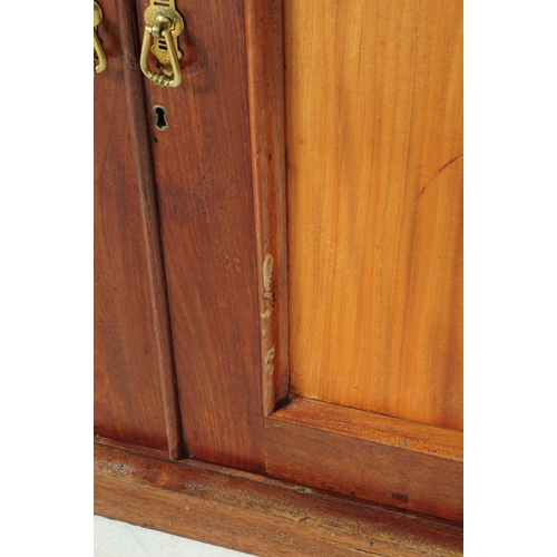 1057 - A large early 20th century mahogany library bookcase cabinet. With pediment top, twin lead glazed hi... 