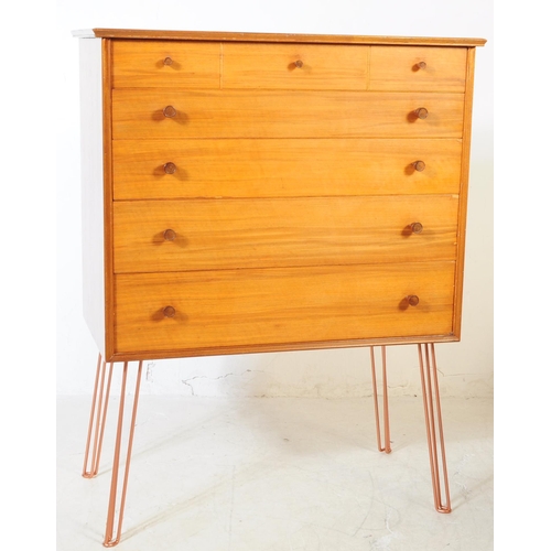 550a - Alfred Cox - A vintage mid 20th century chest of drawers. Rectangular form with flared top, bank of ... 