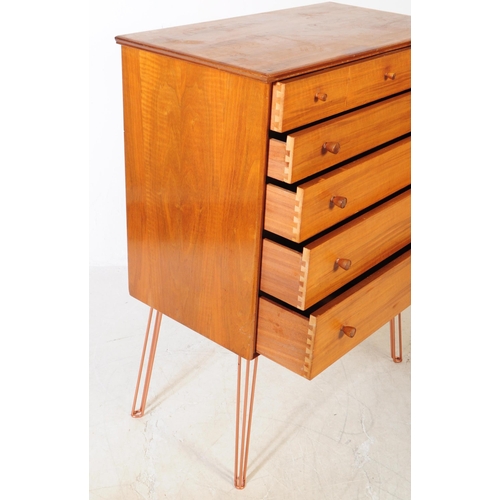 550a - Alfred Cox - A vintage mid 20th century chest of drawers. Rectangular form with flared top, bank of ... 