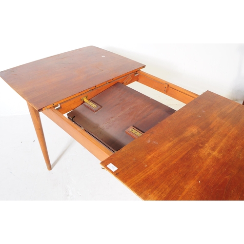 555 - British Modern Design - A mid century teak dining table and four chairs. Rectangular form with exten... 