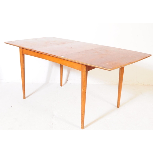 555 - British Modern Design - A mid century teak dining table and four chairs. Rectangular form with exten... 