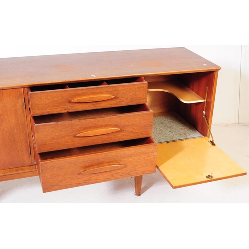 557 - Jentique Furniture - A mid 20th century teak wood sideboard credenza. Rectangular form with twin cab... 