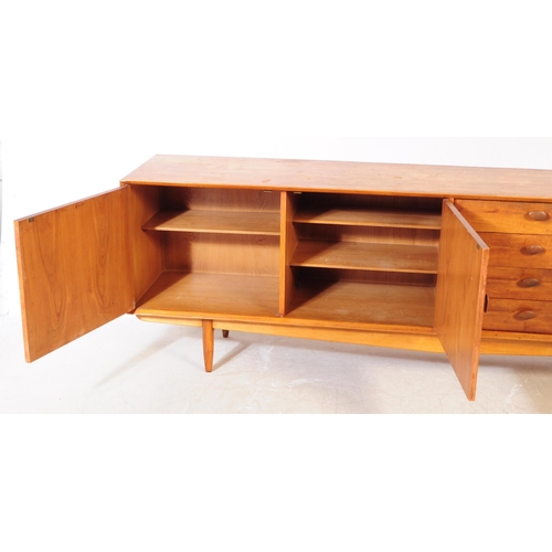 557a - British Modern Design - Vintage mid century long john teak wood sideboard credenza. Rectangular form... 