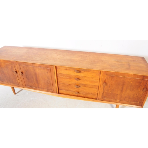 557a - British Modern Design - Vintage mid century long john teak wood sideboard credenza. Rectangular form... 