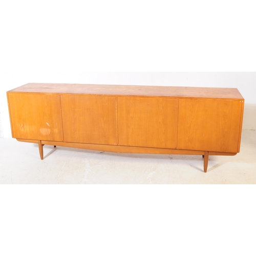 557a - British Modern Design - Vintage mid century long john teak wood sideboard credenza. Rectangular form... 