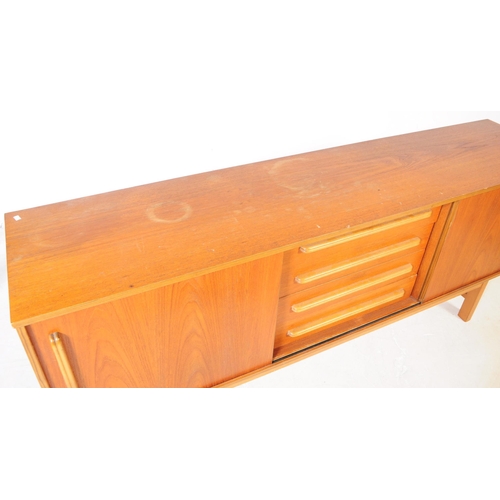 558 - British Modern Design - A mid 20th century circa 1960s teak wood sideboard credenza. The sideboard o... 