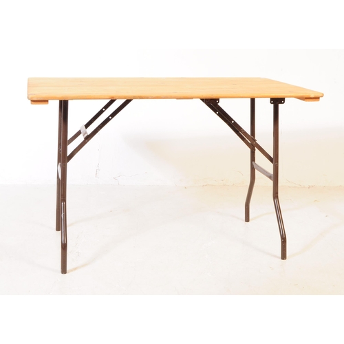 559a - A vintage 20th century pine top bierkeller style trestle table. Rectangular form with plank top on f... 