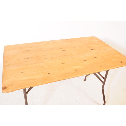 559a - A vintage 20th century pine top bierkeller style trestle table. Rectangular form with plank top on f... 