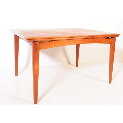 561a - Danish Modern Design - A vintage mid 20th century teak veneered dining table. With draw leaf extensi... 