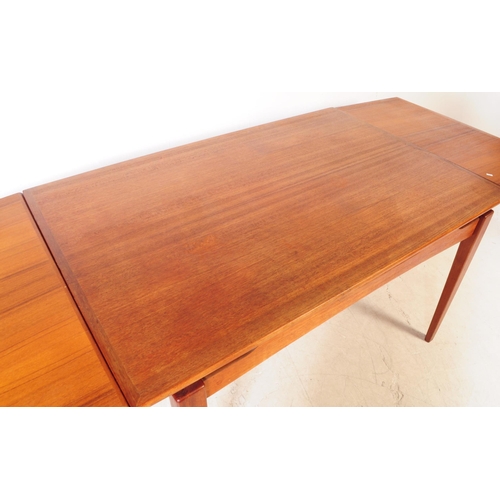 561a - Danish Modern Design - A vintage mid 20th century teak veneered dining table. With draw leaf extensi... 