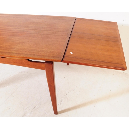 561a - Danish Modern Design - A vintage mid 20th century teak veneered dining table. With draw leaf extensi... 