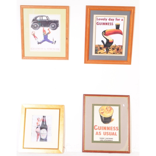 564 - Guinness - A collection of four advertising reproduction Guinness prints. Framed and glazed. Depicti... 