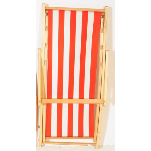 577 - Four contemporary beech wood garden furniture beach deck chairs. The collection to include three lar... 