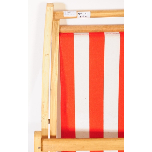 577 - Four contemporary beech wood garden furniture beach deck chairs. The collection to include three lar... 