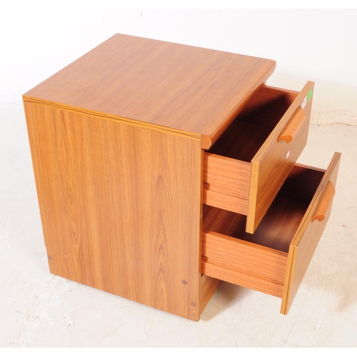 579 - British Modern Design - A pair of retro mid 20th century teak bedside cabinets. Each having a bank o... 